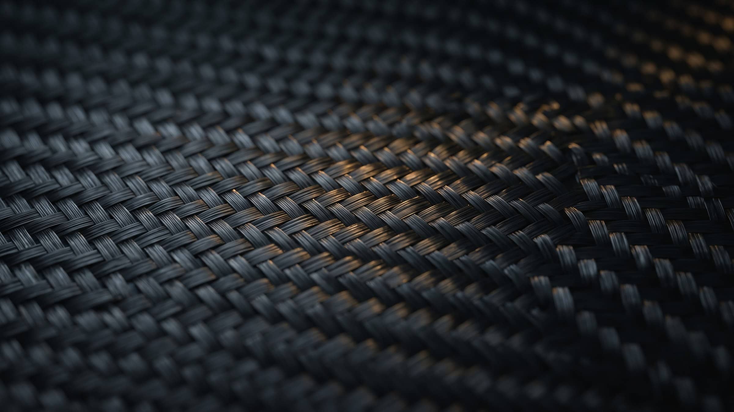 Woven carbon fibre cloth seen close up