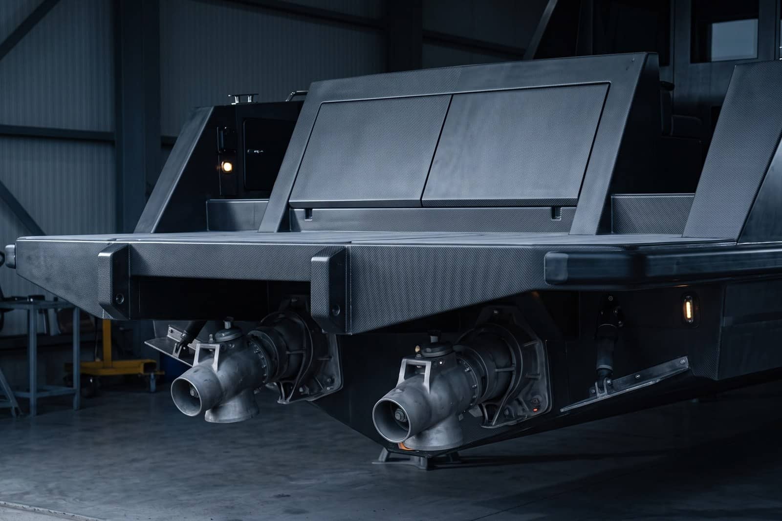 A vessel hull with carbon fibre decking and waterjet drives